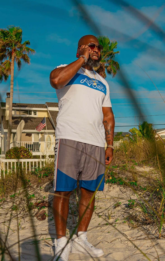 Street League Shorts by Avoir – Premium Athletic Streetwear model on the beach in a stylish pose.