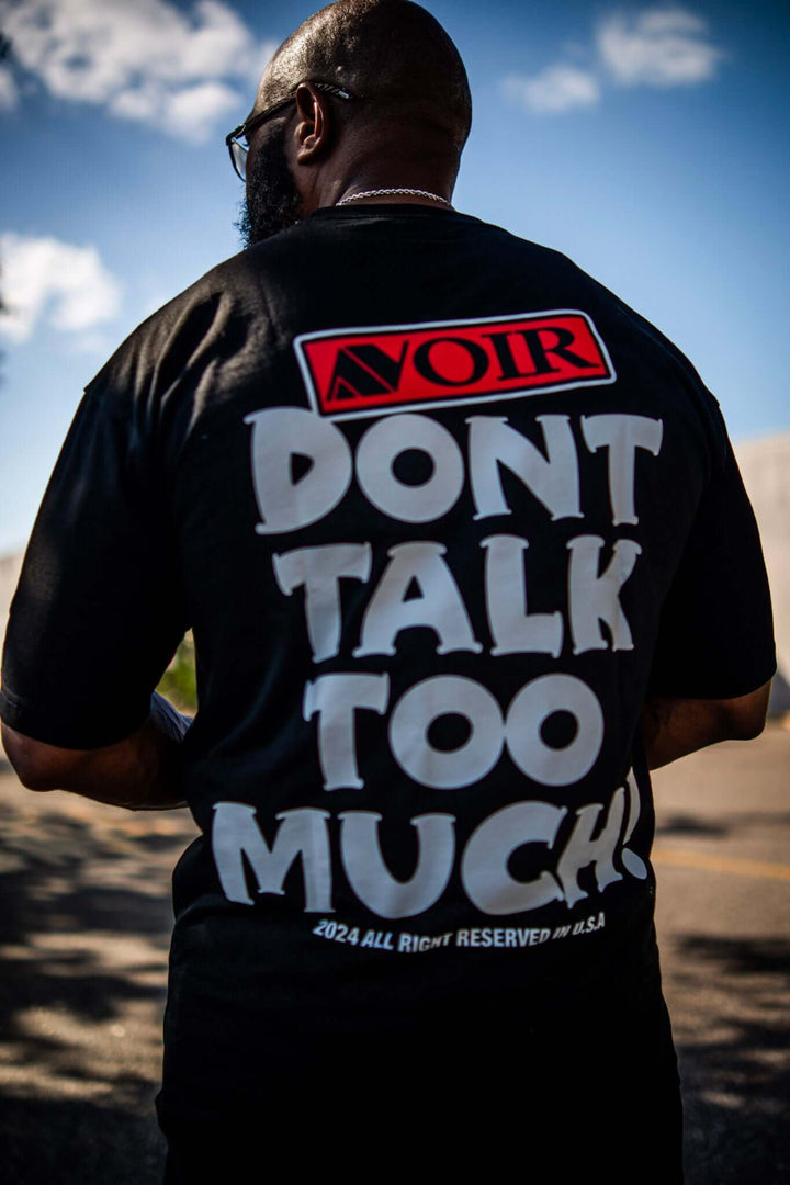 Say Less Tee by Avoir Couture – Oversized Graphic Streetwear featuring bold message 'DON'T TALK TOO MUCH' on back.
