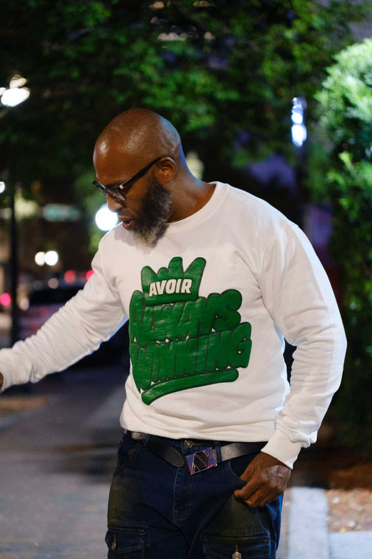 Always Winning Sweatshirt | Avoir Couture modeled under street lights, showcasing premium streetwear style.