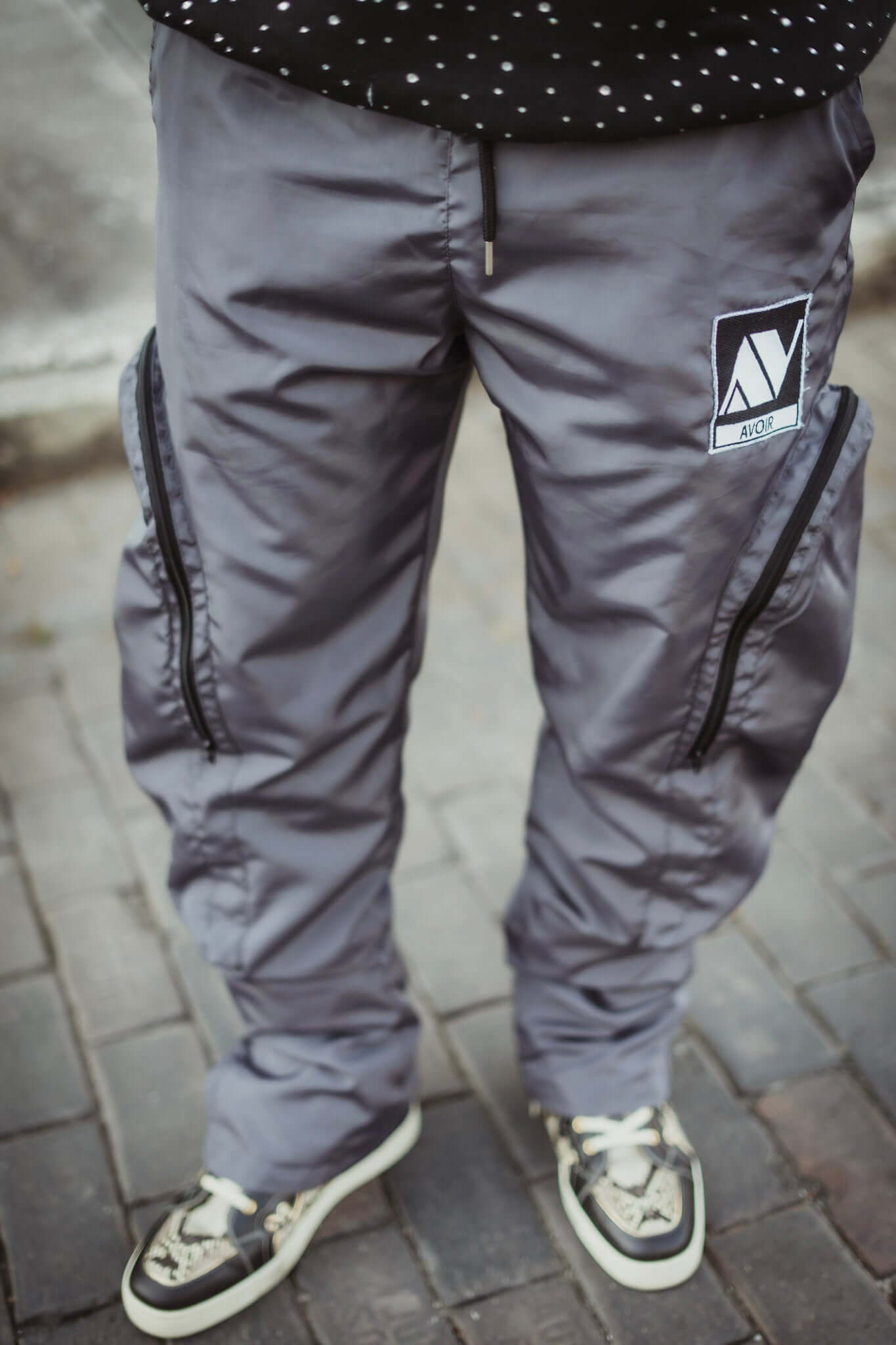 Parachute Cargo Pants | Avoir Couture worn by model showcasing street style and oversized pockets.