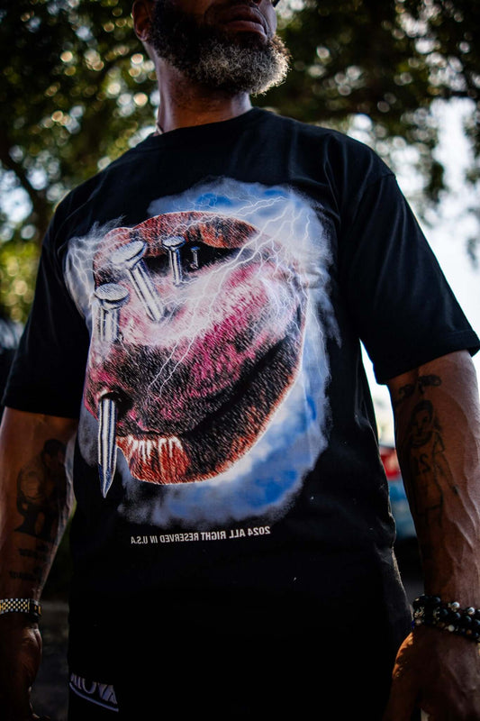 Say Less Tee by Avoir Couture – Oversized Graphic Streetwear featuring bold graphic of pierced tongue on black tee.